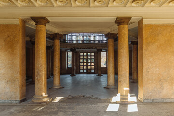 Entrance hall with columns in old abandoned mansion