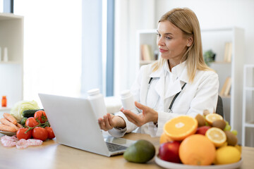 Telehealth and telemedicine concept. Mature nutritionist female doctor explaining medical treatment...