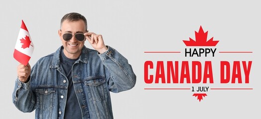 Happy mature man with Canadian flag on light background. Banner for Canada Day