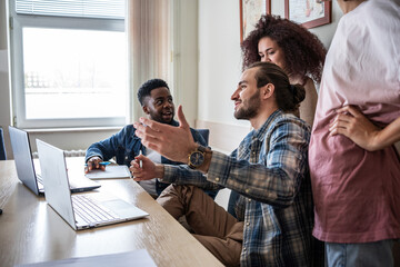 A group of students, huddled over textbooks and notes, diligently prepare for an upcoming exam.	
