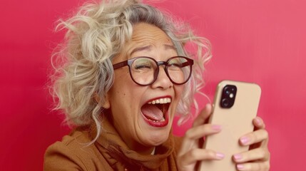 Fototapeta premium Stylish Woman With Glasses Captivated by Cell Phone