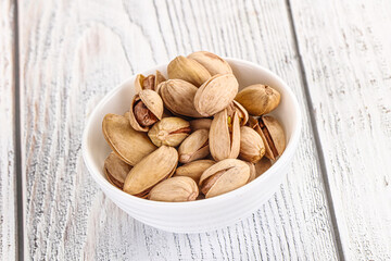 Salted tasty pistachio nuts heap