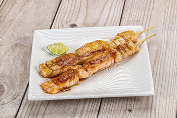 Grilled salmon skewer with sauce