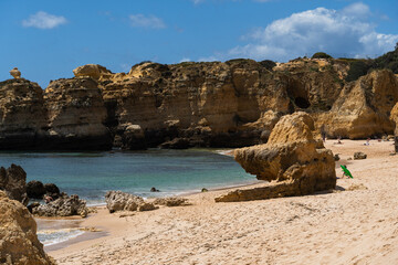 São Rafael beach, Albufeira, Algarve, Portugal. Sunny day. Rocks and cliffs on the beach. Crystal...