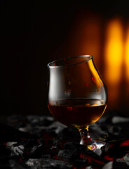 Snifter of brandy on a burning charcoal.