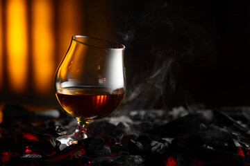 Snifter of brandy on a burning charcoal.