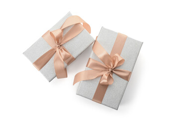 Gift boxes tied with beige ribbon on white background. Top view