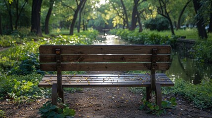 Serene wooden bench by the tranquil forest stream surrounded by lush greenery and sunlight filtering through the trees in a peaceful park