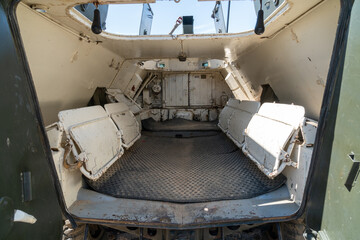 Old abandoned rusty military truck interior.