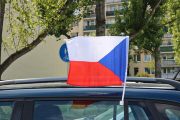 Czech flag attached to a car fluttering in the wind