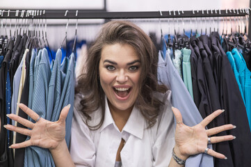 Smiling fat woman in plus size store looking at camera. 