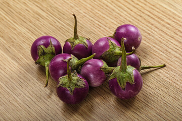 Raw small purple asian baby eggplant