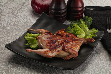 Grilled quail in the plate