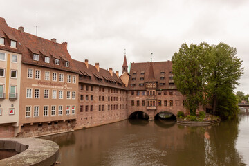 Fototapeta premium View of Heilig-Geist-Spital from Museumsbrücke in Nuremberg