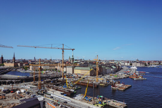 High angle view construction site in city against sky