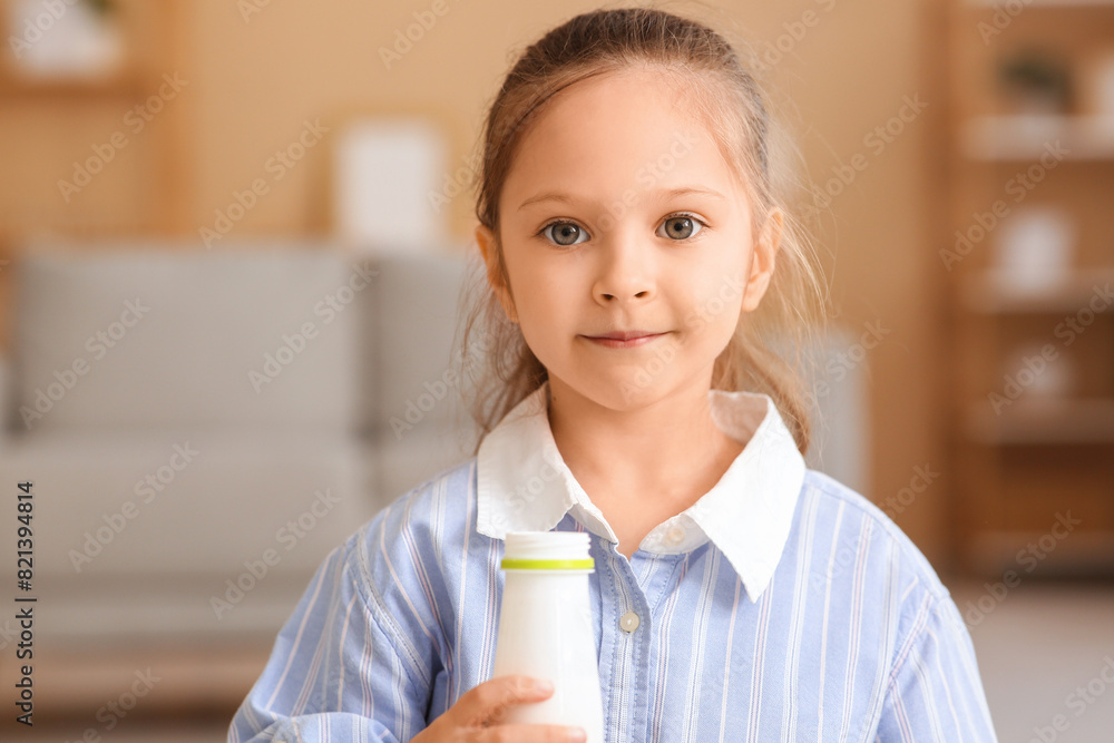 Sticker Cute little girl with bottle of yogurt at home