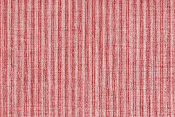 Ridge texture background of velour corduroy red cloth. Large ribbed, coarse weaving velveteen, striped upholstery texture fabric, furniture textile material, design, decor