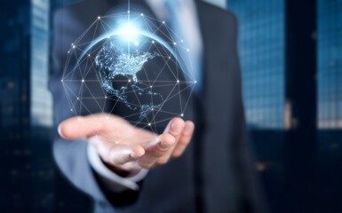 Male businessman with abstract world globe