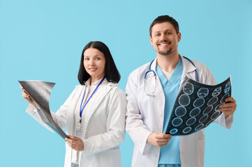 Doctors with x-ray images on blue background