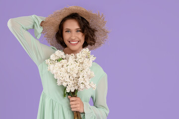 Beautiful young woman with bouquet of blooming white lilac flowers on color background