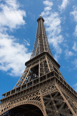 View on Eiffel Tower against cloudy sky, Center of Paris, France