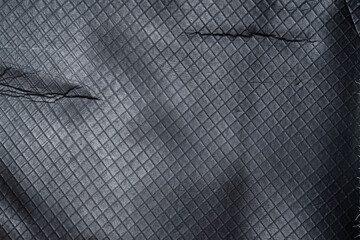 top shot of rubbery dark texture with grid surface