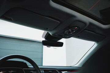 Modern black subcompact electric crossover SUV with black interior. Details interior.