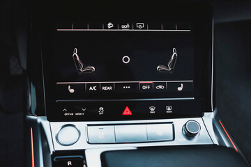 Modern black subcompact electric crossover SUV with black interior. Details interior.