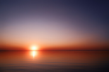 Beautuful sunset on the sea with sun reflecting in water
