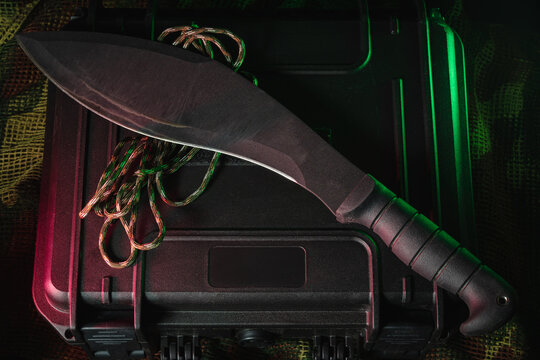 Large tactical kukri knife on the hard case, close-up photo.