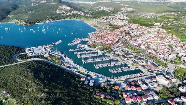 Aerial high quality view of Izmir tourist village Sigacik, its historical castle, fishing shelter and Teos marina