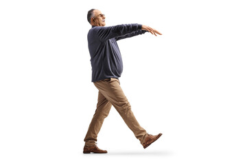 Full length profile shot of a mature man sleepwalking