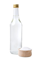Vinegar in glass bottle and baking soda isolated on white