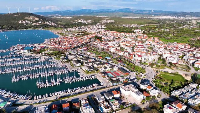 Aerial high quality view of Izmir tourist village Sigacik, its historical castle, fishing shelter and Teos marina