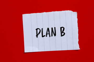 Plan b words written on ripped paper with red background. Conceptual plan b symbol. Copy space.