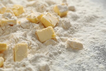 Making shortcrust pastry. Flour and butter on table, closeup
