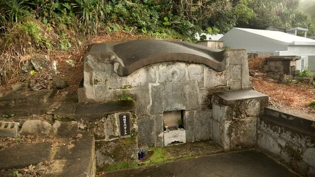 Typical Japanese Cemetery in Okinawa Islands, Japan. The peculiarly shaped Okinawan tombs known as kamekoubaka. The traditional Okinawan turtleback tomb. High quality 4k footage