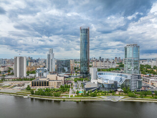 Yekaterinburg city with Buildings of Regional Government and Parliament, Dramatic Theatre, Iset Tower, Yeltsin Center, panoramic view at summer sunset.