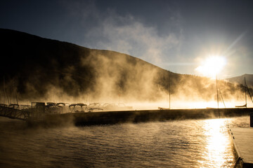 A steamy and foggy marina on Lake Dillon at sunrise on a cold winter morning in the Rocky Mountains (Summit County, Colorado, USA)