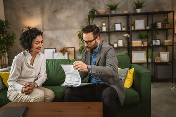 Mature woman talk with adult man about document she need to sign