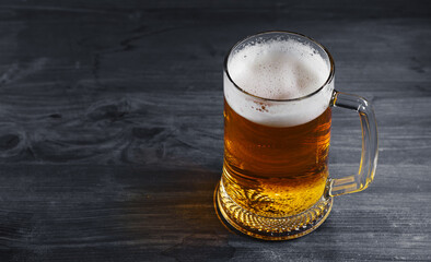 A mug of beer on a wooden table