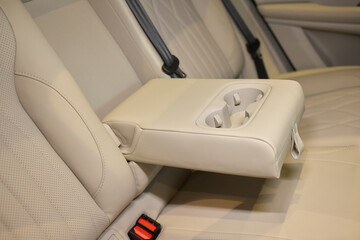 Vehicle armrest with cup holder, beige wood design, for luxury cars