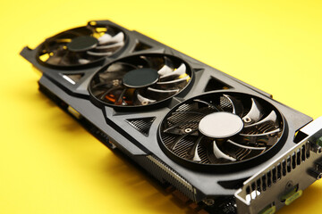 One graphics card on yellow background, closeup