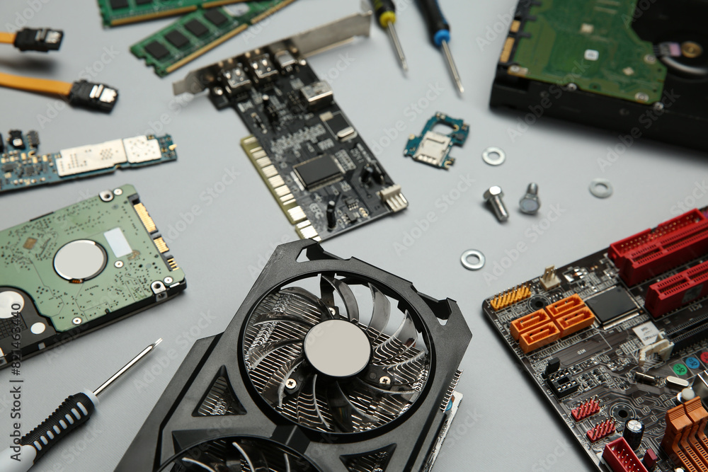 Aufkleber graphics card and other computer hardware on light background, above view