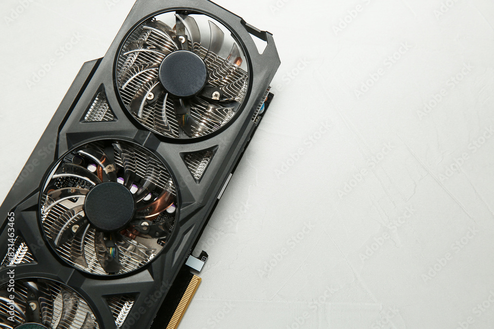 Fototapete computer graphics card on gray textured background, top view. space for text