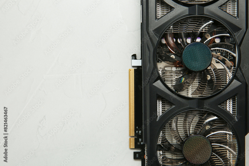 Fototapete computer graphics card on gray textured background, top view. space for text