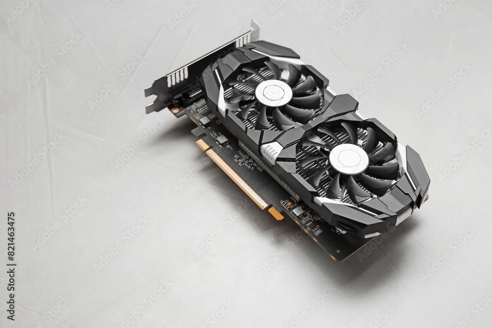 Fototapete computer graphics card on gray textured background, space for text