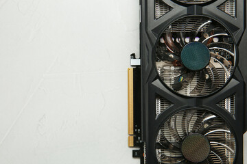 Computer graphics card on gray textured background, top view. Space for text