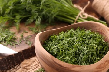 Fresh cut dill in bowl on table, closeup