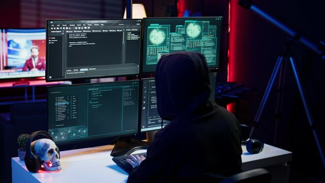 Cybercriminal coding, developing zero day exploit undetectable by antivirus software installed on systems, close up shot. Hooded developer building script able to trick firewalls, camera B